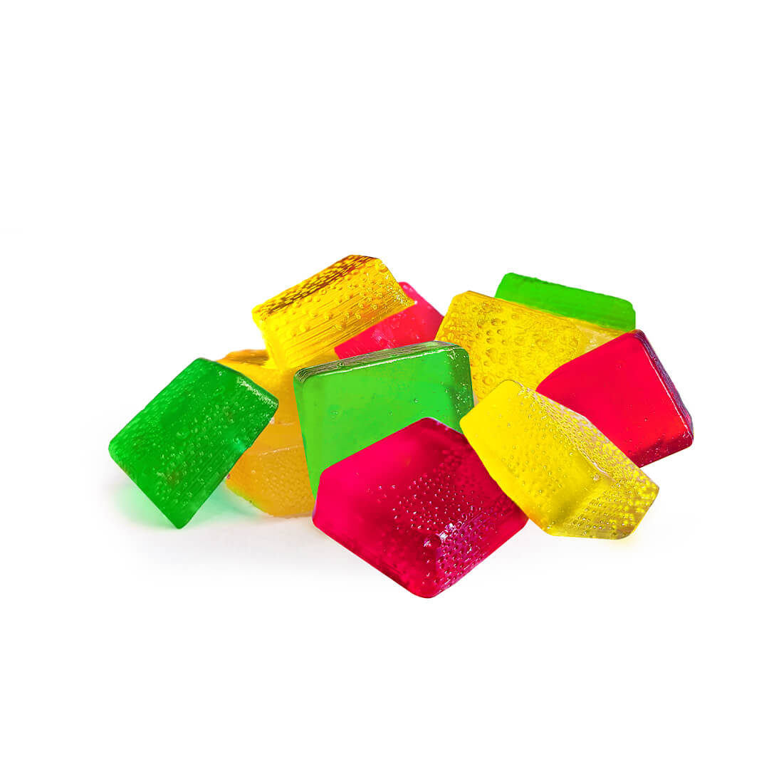 A pile of colorful Delta 9 Gummies on a white background.