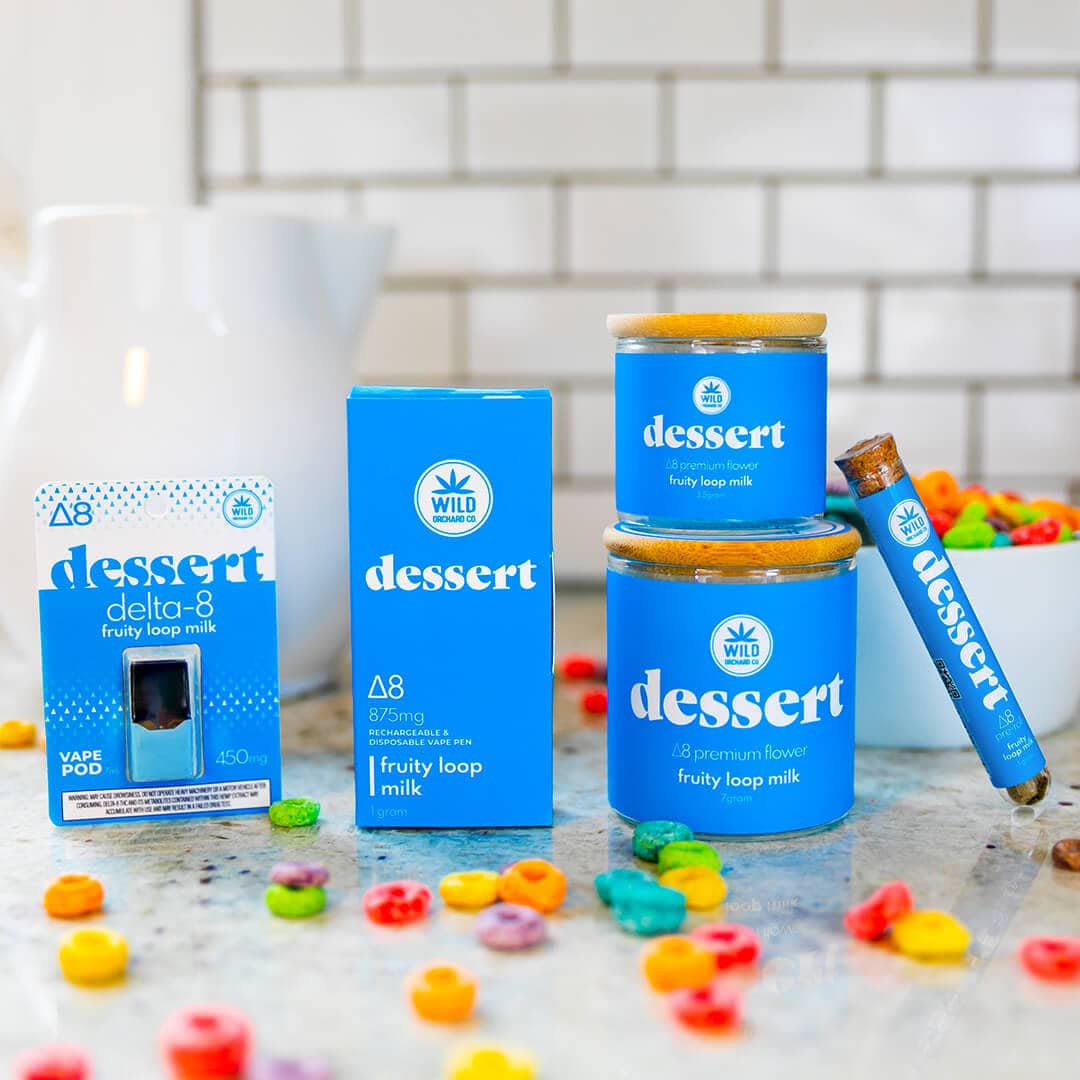 Dessert Delta 8 Flavored Pre Roll "Fruity Loop Milk" cbd gummies and candy on a counter.